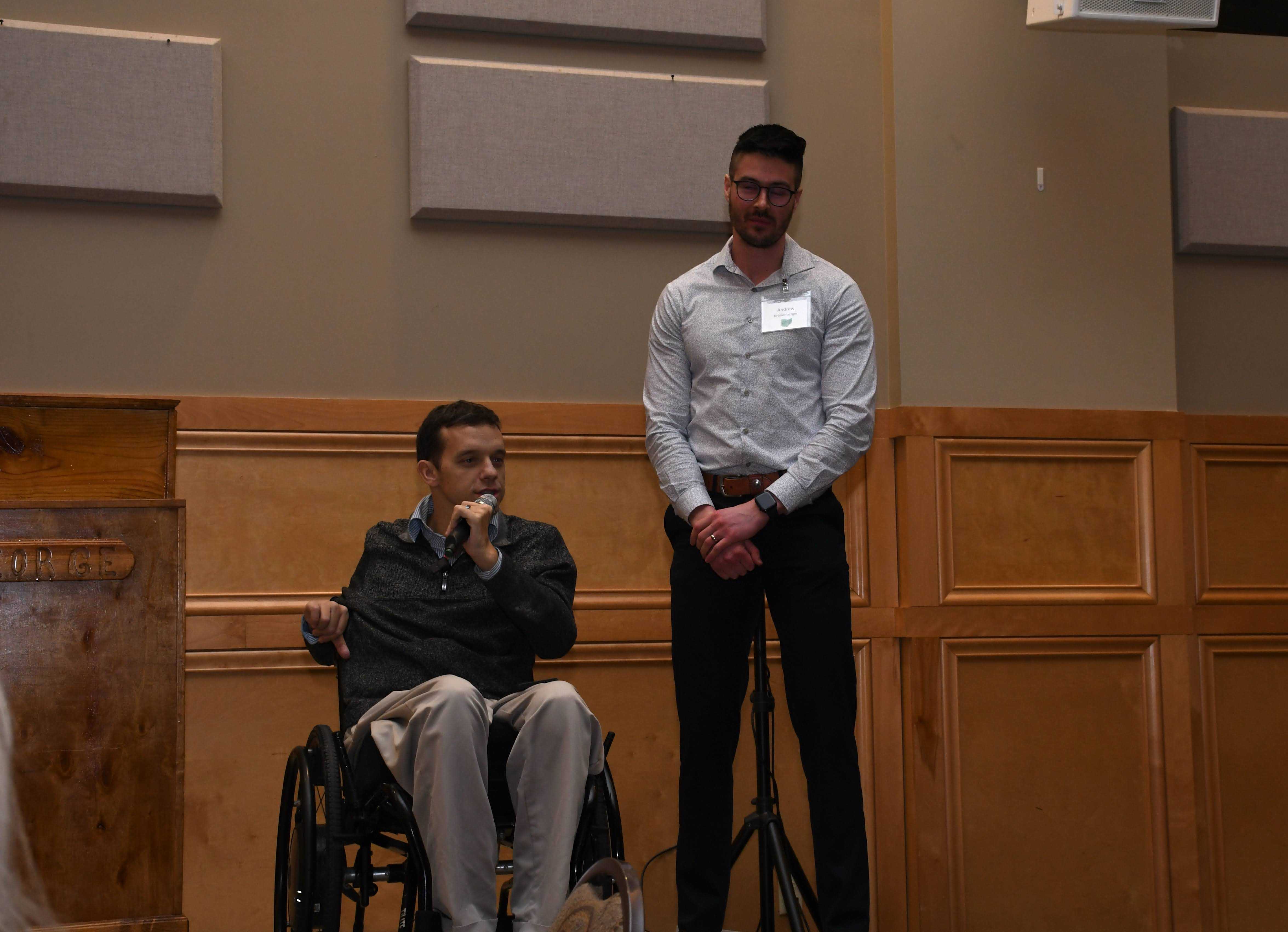Kory Wiita and Andrew Kronenberger speaking at an Arc Medina event